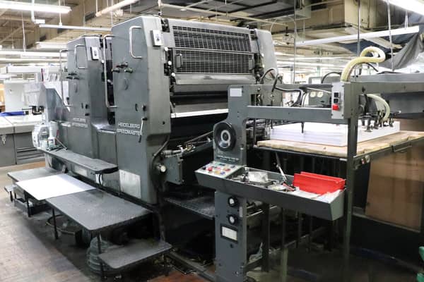 Heidelberg Speedmaster offset printing press with feeding and delivery systems