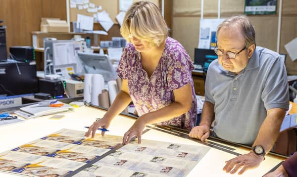 Skilled print operators ensuring quality control at Philly Printing Company